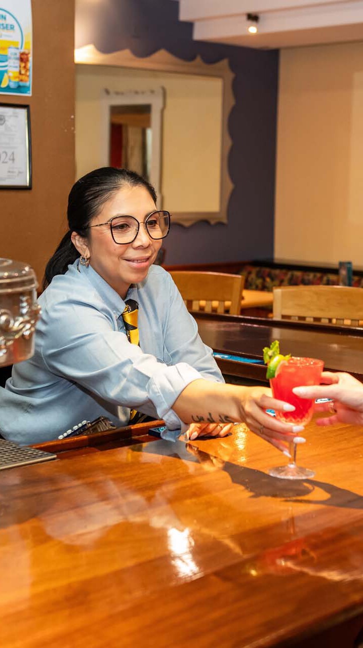 Bartender serving drink