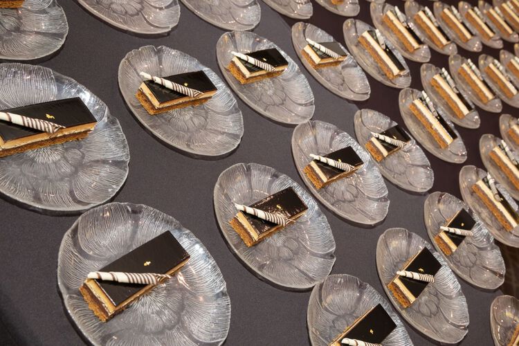 Rows of cake slices on plates