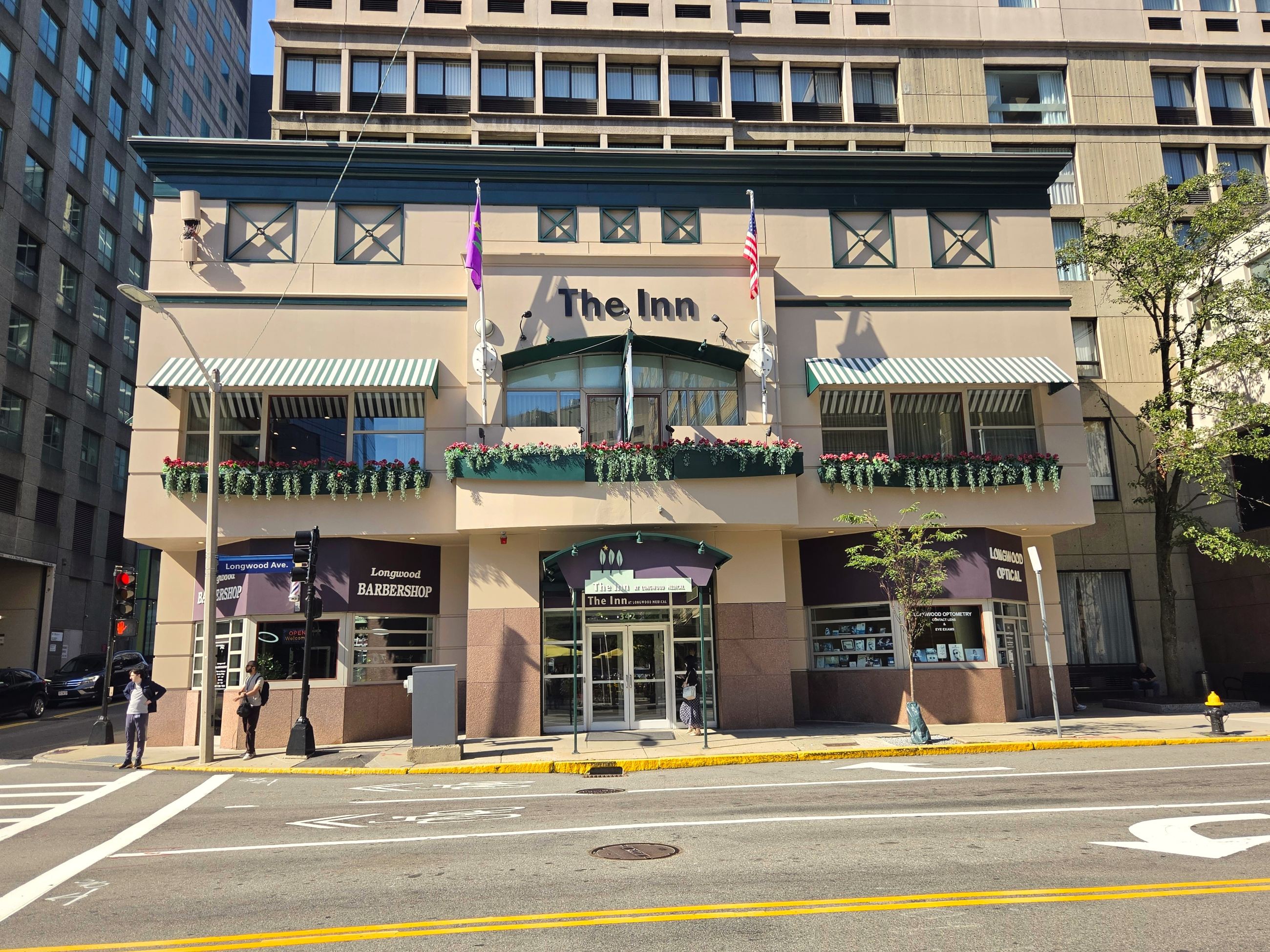 The front of a hotel building with a sign reading 'The Inn'